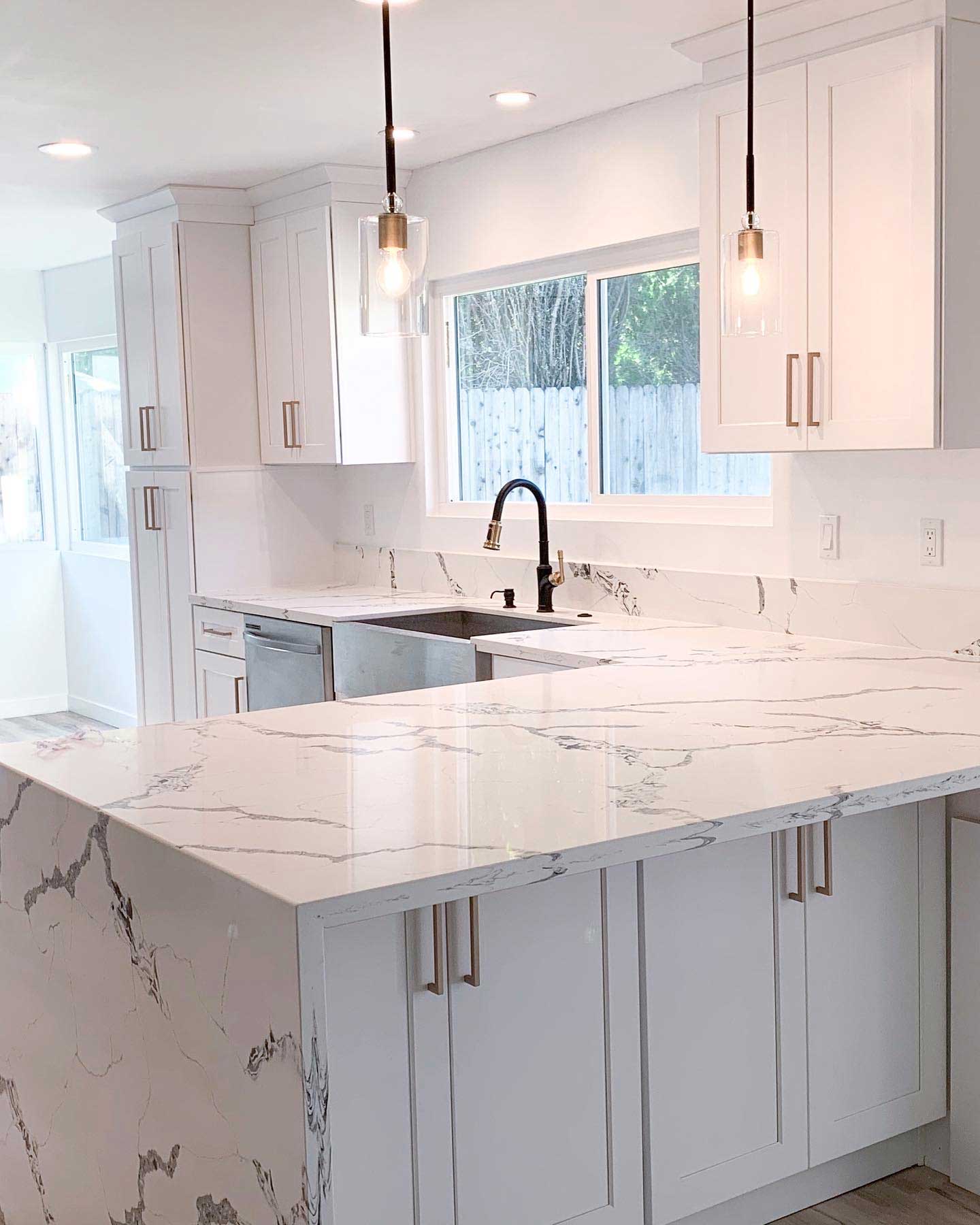 Photo of beautiful countertop in kitchen for article explaining the pros and cons of different countertops